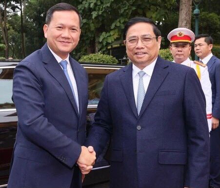 范明正总理欢迎洪玛奈首相。(图片来源:越通社) 范明正总理欢迎洪玛奈首相。(图片来源:越通社)