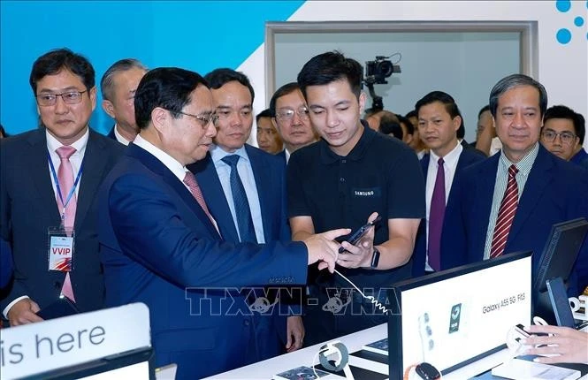 越南政府总理范明正出席2024年越南创新日活动和国家创新中心（NIC）成立5周年庆典。（图片来源：越通社）