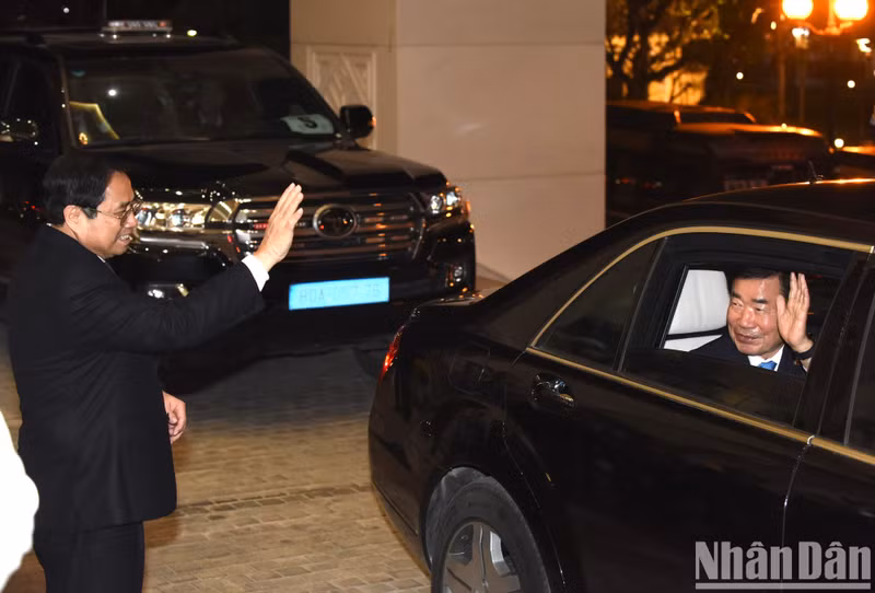 范明正总理拜别韩国国会议长金振杓。