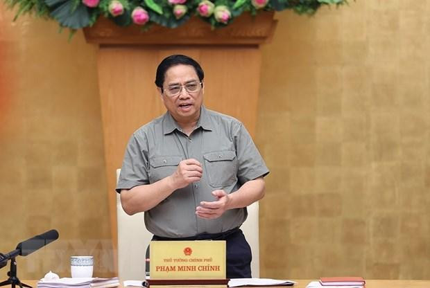 政府总理范明正在会议上发言。（图片来源：越通社）