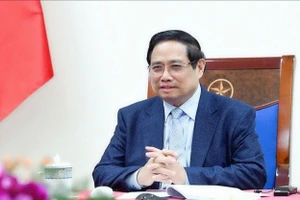 越南政府总理范明正与卡塔尔首相兼外交大臣通电话。（图片来源：VGP）