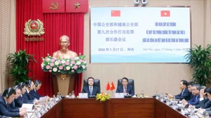 梁三光部长与王小洪部长共同主持越中公安部第九次合作打击犯罪部长级会议。