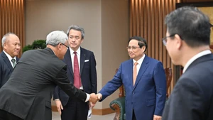 越南政府总理范明正和丸红株式会社社长大本晶之。