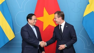 越南政府总理范明正和瑞典首相乌尔夫·克里斯特松。（图片来源：政府门户网站）