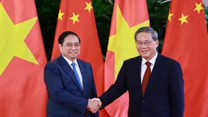 越南政府总理范明正与中国国务院总理李强。