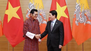 越南国家主席梁强和不丹国王吉格梅·凯萨尔·纳姆耶尔·旺楚克。（图片来源：越通社）