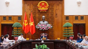 范明正总理主持会议。（图片来源：VGP）