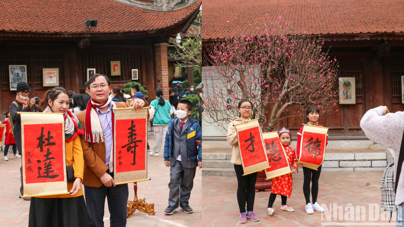 许多家庭带子孙来到这里,让他们更加了解越南的书法艺术。 许多家庭带子孙来到这里,让他们更加了解越南的书法艺术。