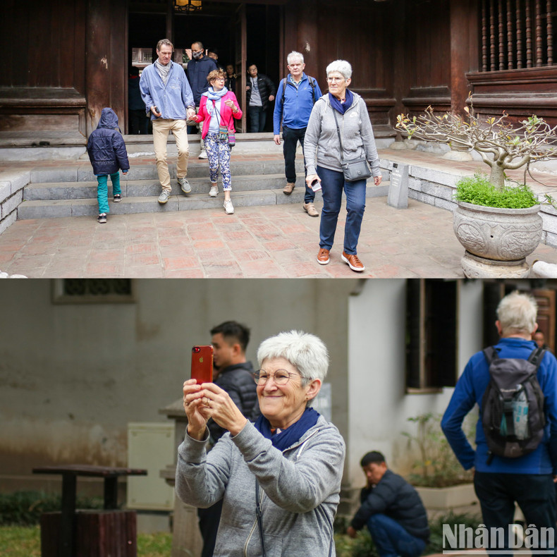 外国游客也兴致勃勃地参观和拍照。 外国游客也兴致勃勃地参观和拍照。