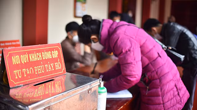 河内人正月十五出去烧香拜佛 祈求平安（组图） ảnh 9