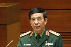 越共中央政治局委员、中央军委副书记、国防部长潘文江大将作报告。（图片来源：越通社）