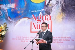 《人民报》社总编辑黎国明在展览上致辞。（成达 摄）