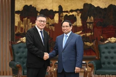 越南政府总理范明正会见中国天虹国际集团有限公司董事会主席洪天祝。