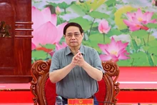 范明正总理主持会议。（图片来源：qdnd.vn）