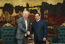 越南政府总理范明正会见中国太平洋建设集团创始人严介。