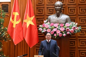 越南政府总理、国家核电站建设指导委员会主任范明正在会上致辞。（陈海 摄）