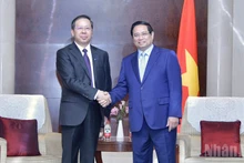 范明正总理与中国华电科工集团有限公司董事长彭刚平董事长。
