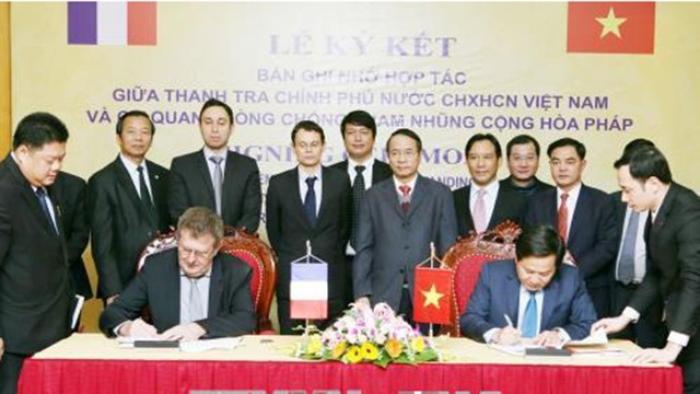 越南与法国关于加强反腐败的合作协议签署仪式。（图片来源：越通社）