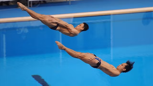 阮松阳与芳世英以467.82分在男子双人三米板决赛中获得亚军。（图片来源：劳动报）