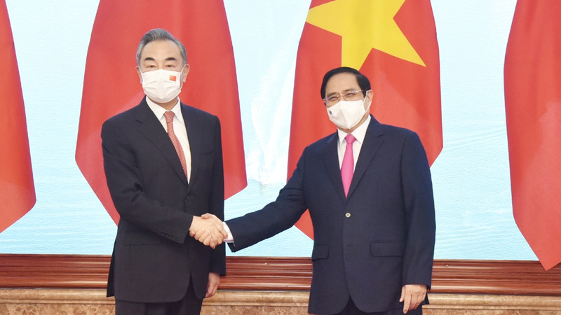 越南政府总理范明正会见中国国务委员兼外交部长王毅。（陈海 摄）