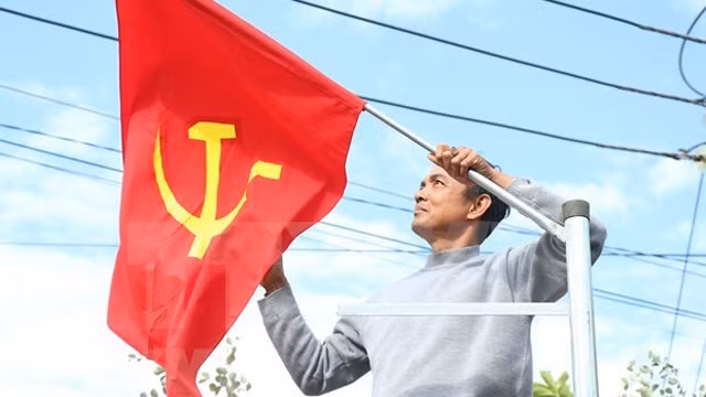 得乐省格穆阿县格穆阿乡人民挂旗。图自越通社