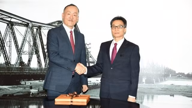 越南政府副总理武德儋会见世卫组织驻越南代表。（图片来源：VGP）