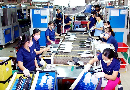 在越南昌信公司工作的工人。 (Photo: 图片来源：同奈省报网)