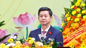 芹苴市市委书记、出席十四大的芹苴市代表团团长黎光松。（图片来源：越通社）