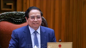 越南政府总理范明正主持召开与CT集团领导的工作会议。（图片来源：越通社）