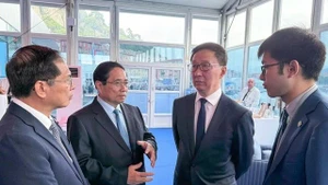 越南政府总理范明正会见中国国家副主席韩正。（图片来源：越通社）