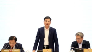 越南国家银行副行长范青河发言。（图片来源：越通社）