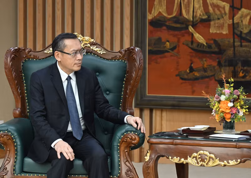 老挝劳动与社会福利部部长坡赛·赛雅颂出席会见。