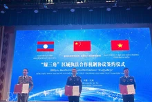 越中老三国代表签署绿三角区域执法合作机制协议。（图片来源：越通社）
