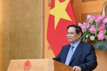 范明正总理在会上发表讲话。