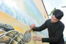 项目对83处建筑进行翻新，并创作了20幅壁画，有助于改善当地居民生计，同时提升社区及游客的海洋保护意识。（图片来源：越通社）