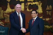 越南政府总理范明正会见俄罗斯塔斯社社长安德烈。（图片来源：越通社）