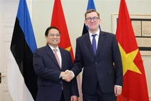 越南政府总理范明正与爱沙尼亚总理克里斯汀·米哈尔。（图片来源：越通社）