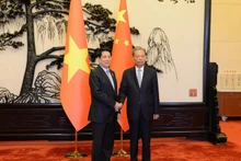 越南国家主席梁强会见中国全国人大常委会委员长赵乐际。
