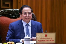 越南政府总理范明正主持召开与CT集团领导的工作会议。（图片来源：越通社）