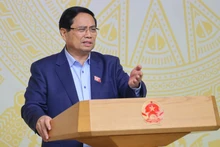 政府总理范明正在会上发表讲话。（图片来源：越通社）