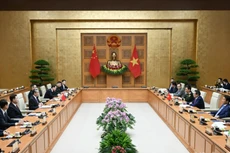 越南政府总理范明正会见中国外交部长、国防部长和公安部长。（图片来源：越通社）