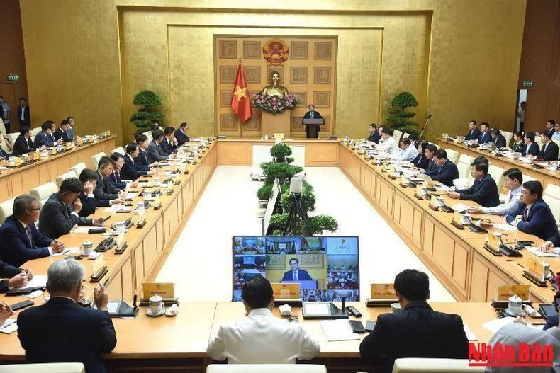 越南政府总理范明正同在越南的韩国企业组织、协会代表举行对话会(组图) ảnh 2 越南政府总理范明正同在越南的韩国企业组织、协会代表举行对话会(组图) ảnh 2