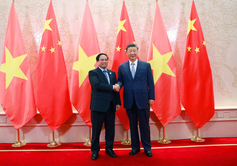 越南政府总理范明正会见中共中央总书记、中国国家主席习近平。（图片来源：VGP）