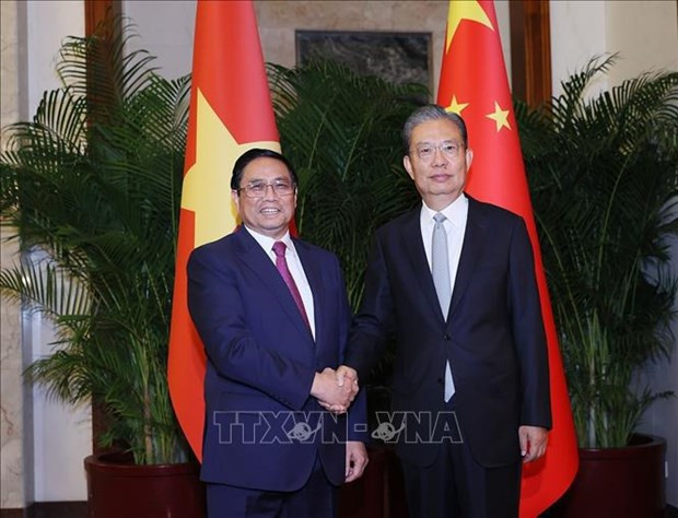 越南政府总理范明正会见中国全国人大委会长赵乐际。（图片来源：越通社）