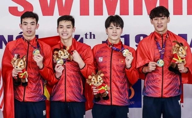 附图：越南体育代表团力争在第32届东南亚运动会上夺得至少100枚金牌的目标。