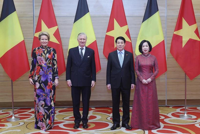 越南国家主席梁强及夫人与比利时国王菲利普及夫人出席招待会。（图片来源：越通社）