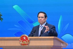 越南政府总理范明正在会上致辞。（图片来源：越通社）