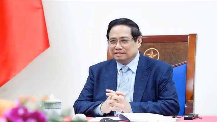 越南政府总理范明正与卡塔尔首相兼外交大臣通电话。（图片来源：VGP）