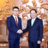 越共中央宣教部部长郑文决和老挝人革党中央宣训部副部长萨科恩·蓬马拉。（图片来源：越通社） 