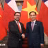 越南外交部长黎怀忠与智利外交部长佩雷。（图片来源：越通社）
